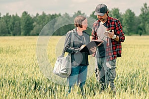 Mortgage loan officer assisting farmer in financial allowance application process