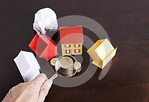 Mortgage loans concept with paper house and coins stack