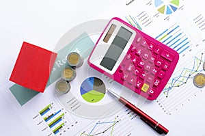 Mortgage loans concept with Red house and coin money and pink calculator and red pen backgrounds above