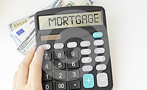 Mortgage pre-approval, calculator with pre-approval text in hands