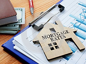 Mortgage rates sign on the home and charts photo