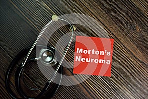 Morton\'s Neuroma write on sticky notes isolated on Wooden Table photo