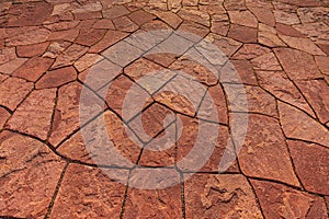 Mosaic background from red flat pavement stones