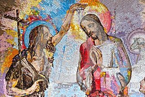 Mosaic of the baptism of Jesus Christ by Saint John the Baptist as the first Luminous mystery. photo