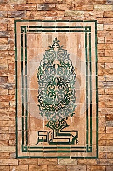 Mosaic on the brick wall