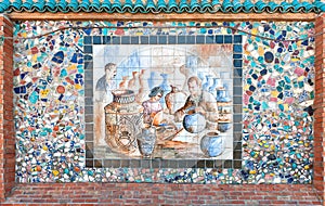 Mosaic of broken pottery and ceramics painting