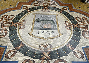 Mosaic of the Capitoline Wolf in the center of the Galleria Vittorio Emanuele II in Milan, Italy`s oldest shopping mall.