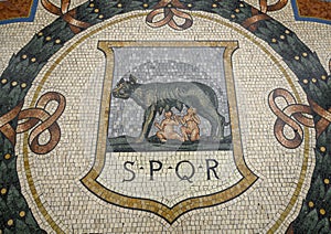 Mosaic of the Capitoline Wolf in the center of the Galleria Vittorio Emanuele II in Milan, Italy`s oldest shopping mall.