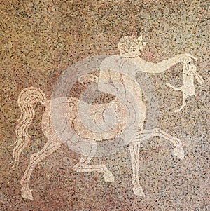 Mosaic of a Centaur holding a rabbit photo