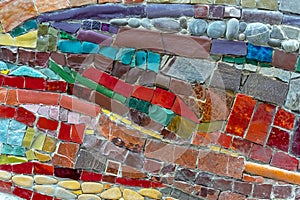 Mosaic of colored tiles and natural stones. Ceramic mosaic background.