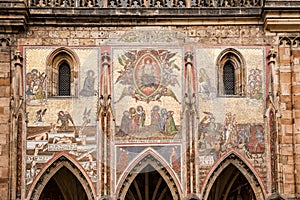 Mosaic on the facade Exterior view of St. Vitus Cathedral in the castle complex in Prague, Czech Republic