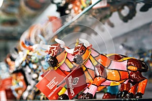 Mosaic figurine of bull in Gaudi style. Spanish traditional gifts in the souvenir shop.