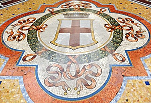 Mosaic pavement with shields in the Galleria Vittorio Emanuele II in Milan, Italy