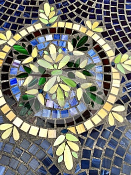 Mosaic tile pattern with circle and leaves