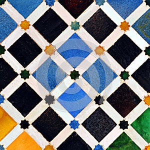 Mosaic of tiles and column, Alhambra palace in Granada, Spain photo