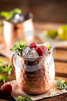 Moscow Berry Mule highball vodka cocktail is a long drink with fresh lime juice, ginger beer and berries