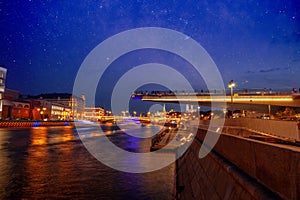 Moscow, the capital of Russia. Night landscape, view of the city center and the river at night. Starry sky over the city