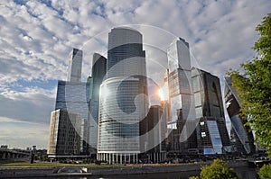 Moscow City business center in the rays of the reflected setting sun.