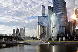 Moscow City business center in the rays of the reflected setting sun.