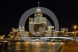 Moscow city landscape with night view on skyscraper on embankment river