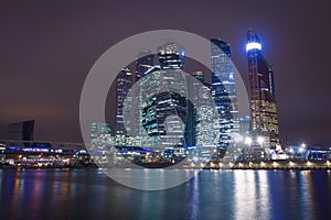 Moscow city night view with skyscrapers and a futuristic bridge