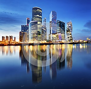 Moscow City skyline.  International Business Centre at night time with Moskva river