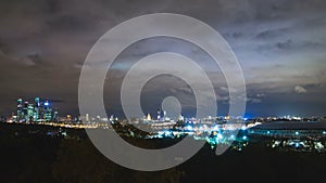 Moscow city skyline in night timelapse. Modern skyscrapers and old buildings.