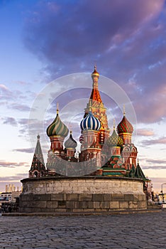 moscow city sunset St. Basil`s Cathedral and Kremlin Walls and Tower in Red square in sunny blue sky. Red square is Attractions