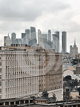 Moscow city towers behind the stalin period building