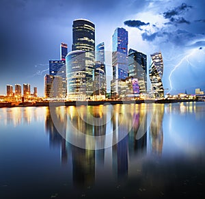 Moscow Internation business centre at night with storm and light