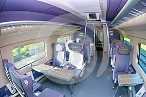 MOSCOW, JUL,12, 2010: Fish eye shot of high speed train Interior saloon inside, passenger seats, tables for train passengers