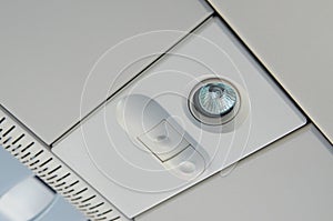 MOSCOW, JULY 12, 2010: View on the passenger`s top light panel with switch above passenger seats of high speed train Pendolino Sm6