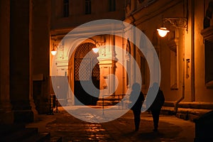 Moscow Kremlin architecture at night. Man and woman silhouettes.