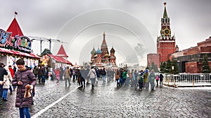 The Moscow Kremlin, crowd of people walking in the Red Square with the unic landscape of of St. Basil`s Cathedral, Lenin`s maus