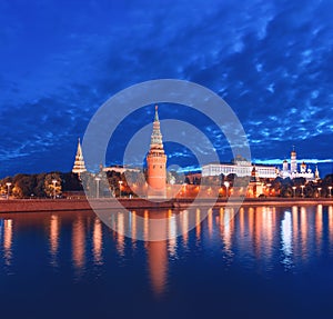 The Moscow Kremlin before dawn. Night illumination of the Kremlin and the reflection of the Vodovzvodnaya Tower in the Moscow Rive photo