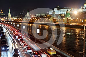 Moscow Kremlin, Moskva River and cars on road.
