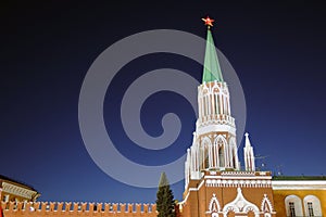 Moscow Kremlin at night. Ruby star is shining. Dark blue sky.