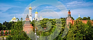 Moscow Kremlin in summer, Russia. Panoramic view of its towers, wall and cathedrals from Zaryadye park