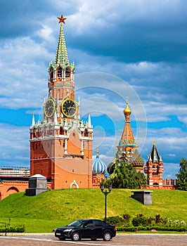 Moscow Kremlin in summer, Russia. Vertical scenic view of Spasskaya Tower and St Basil`s Cathedral