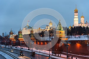 The Moscow Kremlin in the winter night and the Moskva River embankment with a Christmas decoration