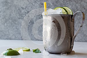 Moscow Mule Cocktail with Lime, Mint Leaves and Crushed Ice in Metal Cup.