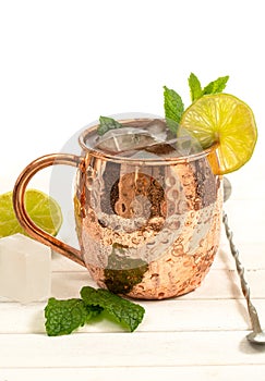 Moscow mule drink with fresh mint, lime, ginger beer and vodka