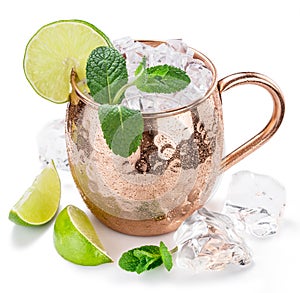 Moscow Mule. Frosty copper mug with lime and ice cubes. photo