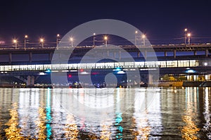 Moscow River, Luzhnetskaya Bridge & x28;Metro Bridge& x29; in the light of night colored lights. Moscow, Russia