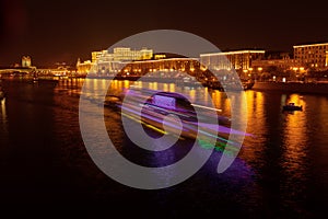 Moscow river with ships at night as background