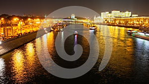 Moscow river with ships at night as background