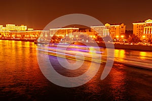 Moscow river with ships at night as background