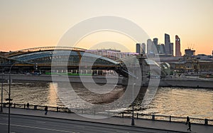 Moscow, Russia, April 11, 2021: Panorama of evening Moscow with view of Moscow river and Berezhkovskaya embankment and  pedestrian