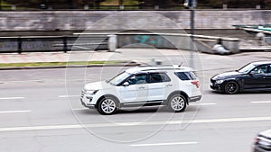 Ford Explorer SUV vehicle in motion on the city road. Fast moving car on Moscow streets