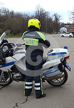 The inspector of the road police patrol on the service motorcycle controls the road.